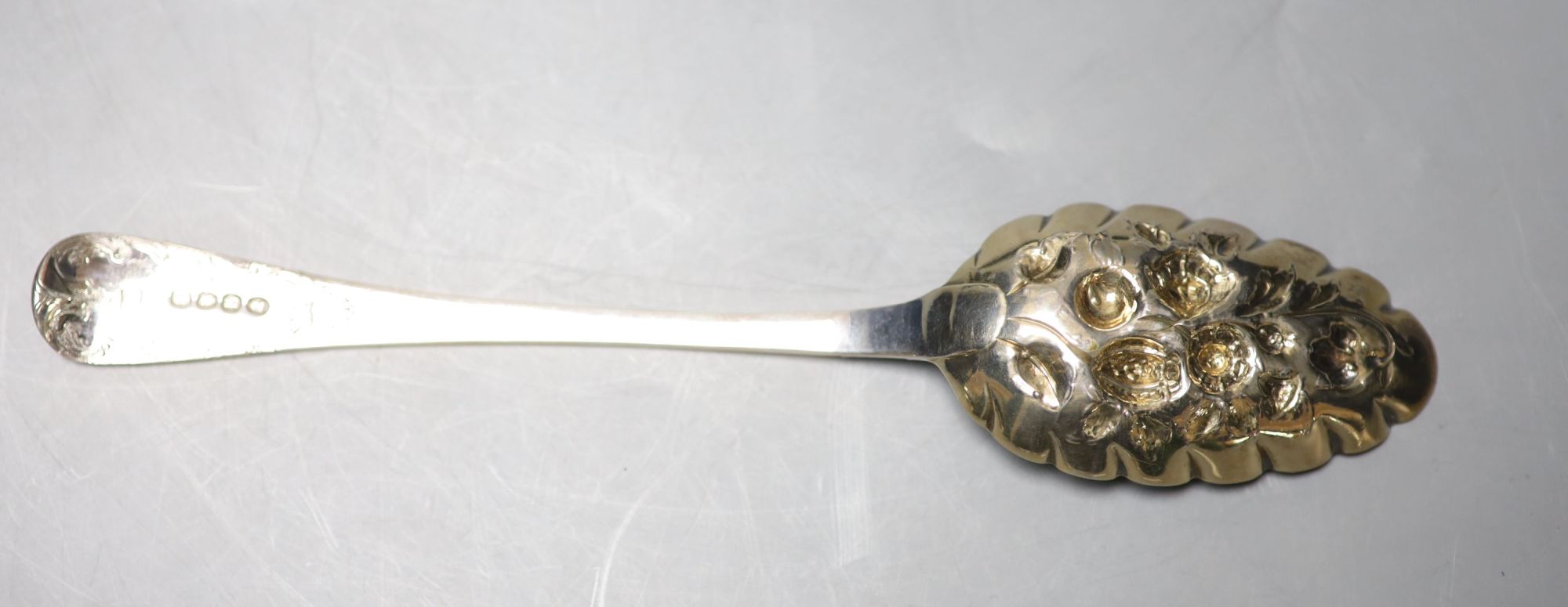 A pair of George III later embossed berry spoons, John Lias, London, 1817, 22.5cm